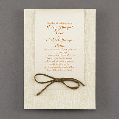 Having a natural wedding with touches of elegance? Send this embossed wood grain invitation on shimmer paper. Jute cord 